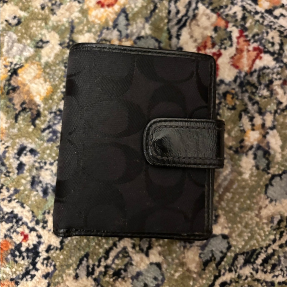 Authentic black Coach wallet; extremely good condition with multiple pockets…